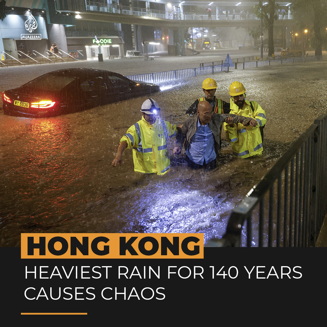 Video shows a woman getting swept along a street by flash floods in Hong Kong, where the heaviest rain for 140 years has caused havoc ⤵️