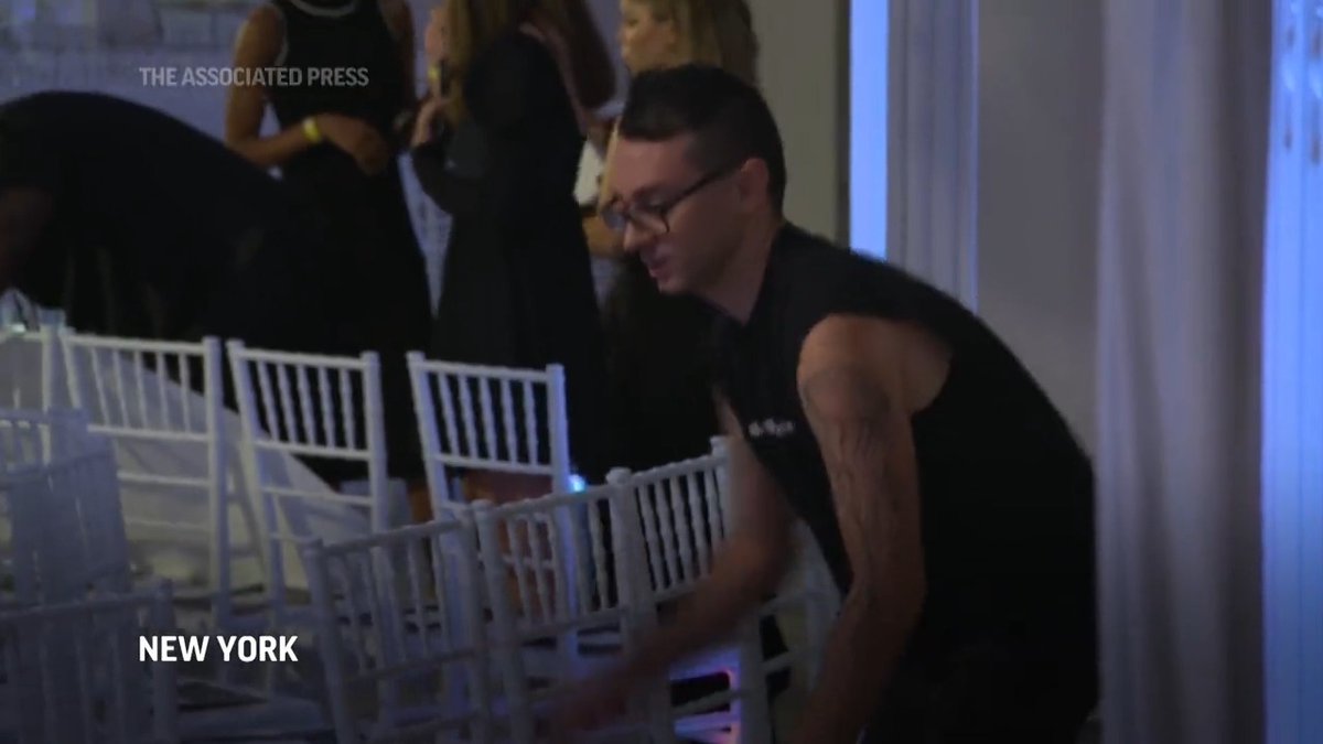 There's no job too big or too small for Christian Siriano on the day of his 15th anniversary fashion show. He even helps set up prior to the big event.