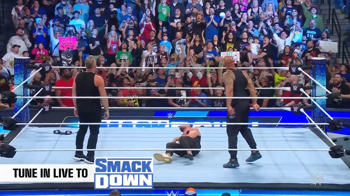 The Rock delivers a People’s Elbow in his return to WWE.