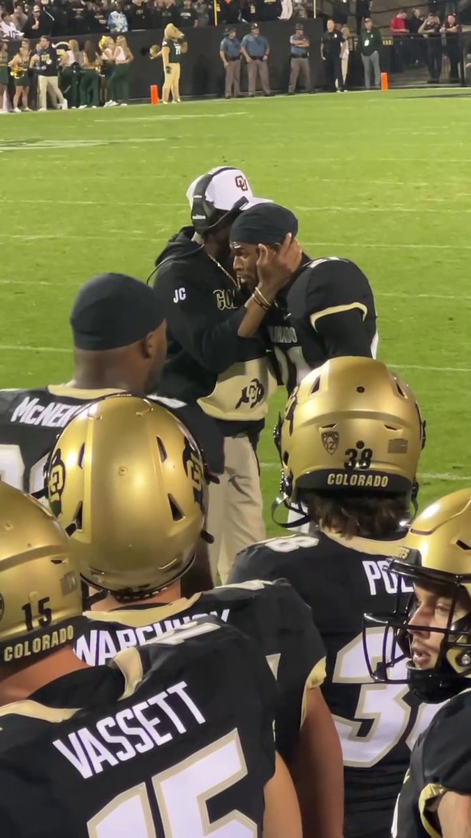 Deion and Shilo Sanders sharing a moment after his pick-six 👏