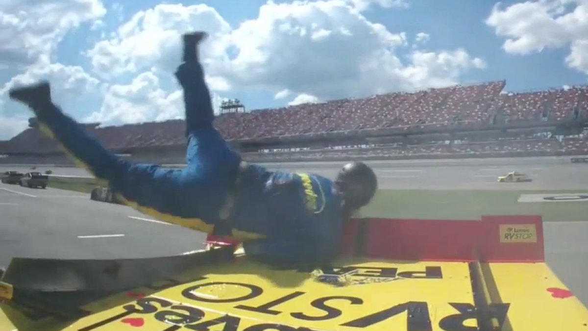Zane Smith sends a crew member flying during a spin on pit road. He jumps right back up and walks it off. These guys are just built different. Wow.