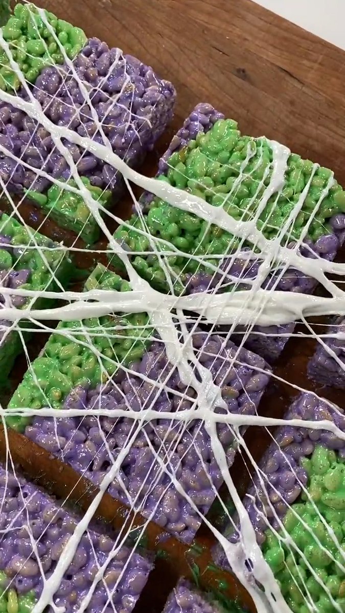 Melted marshmallows make edible COBWEBS for Halloween crispy treats 🕸 Get the recipe: