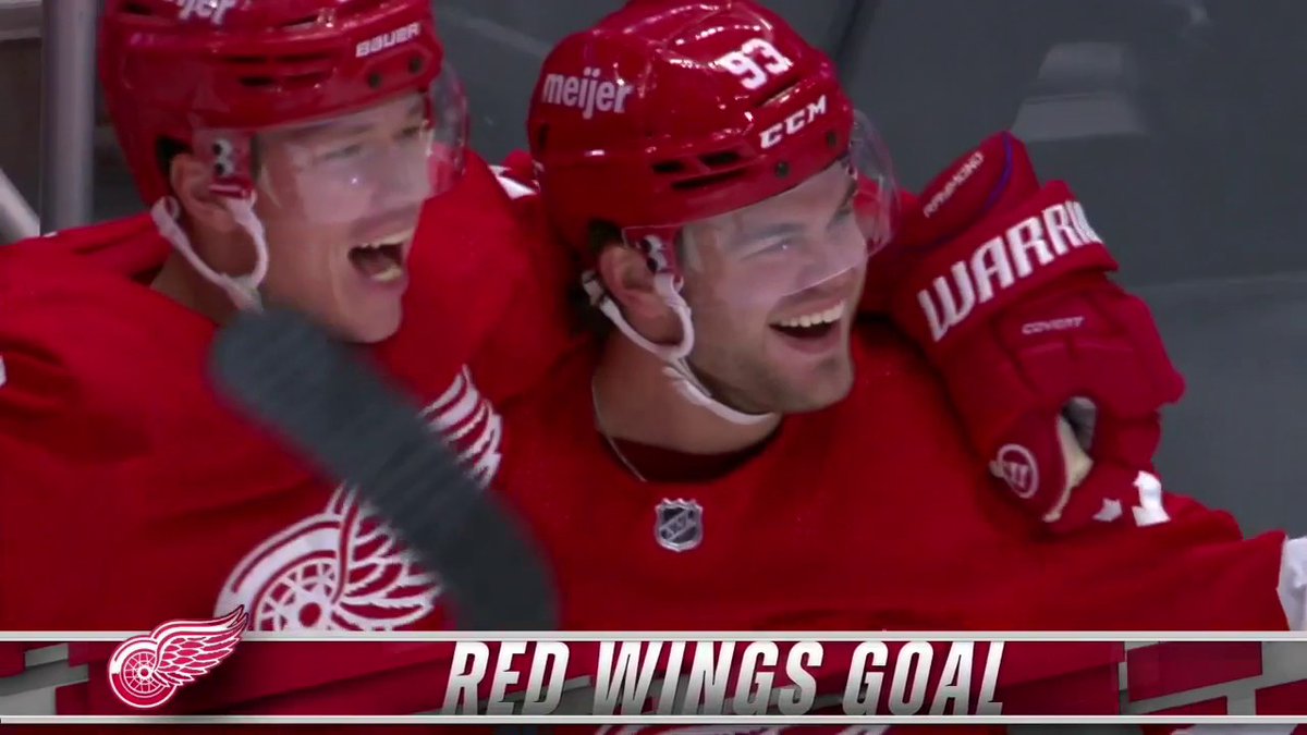Grinning ear to ear Old school Hockeytown horn, Eminem playing, Alex DeBrincat is living his dream