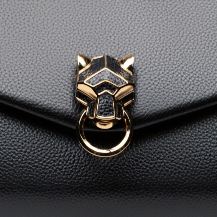 Wild, urban, precious, the Panthère de Cartier bag has personality. Radical and powerful, its panther head jewelled clasp gives character to style. #PanthèredeCartier
