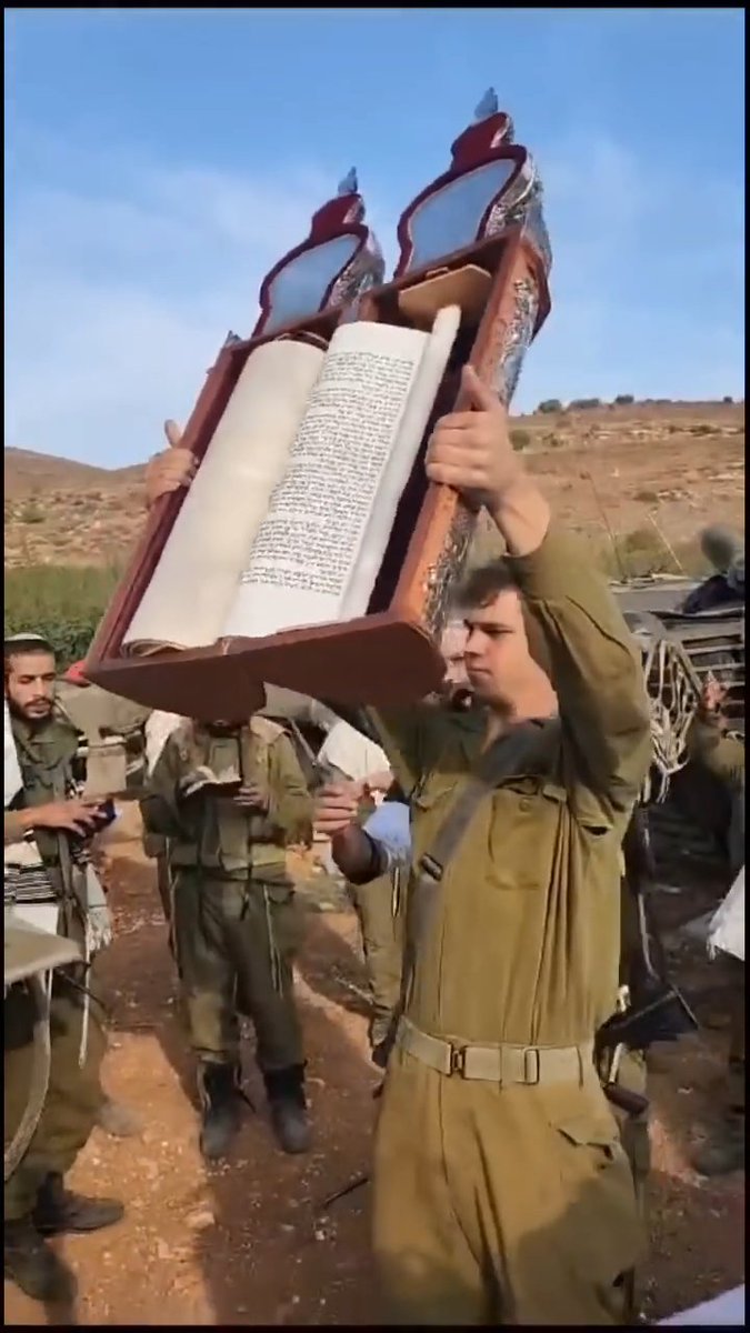Zionist Rabbis are reading the Torah to the Zionist occupying forces and reading war passages to bless them before they head to war!