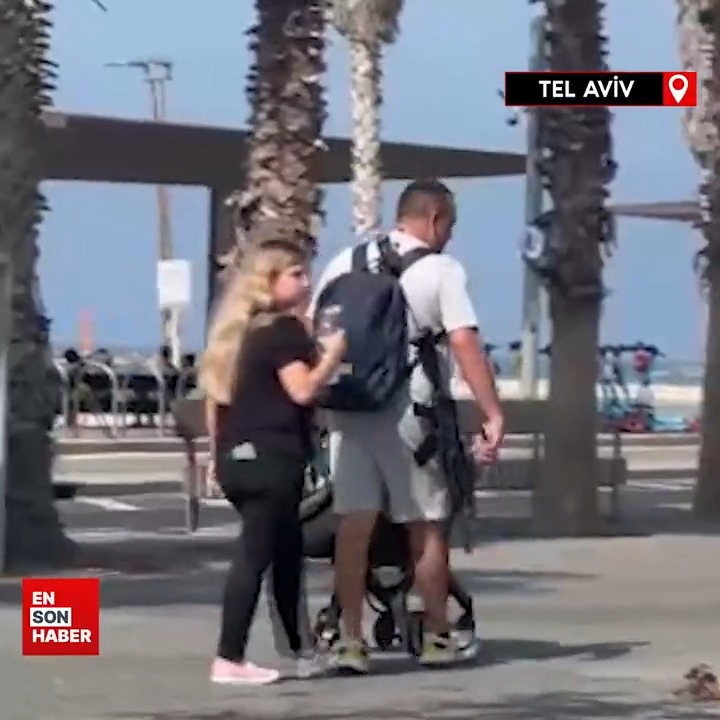 İsrail'in başkenti Tel Aviv'in sokaklarında sivil kıyafetli şahıslar uzun namlulu silahlarla dolaşıyor!