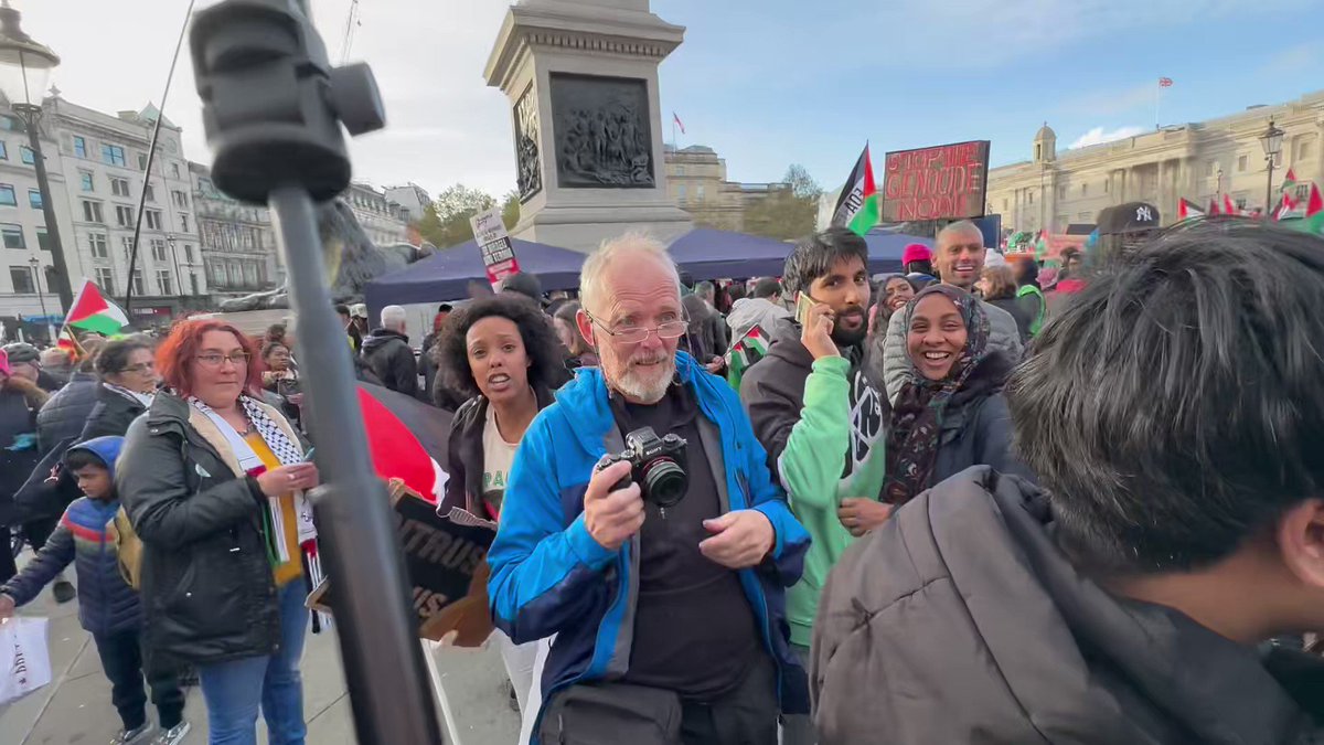 Palestinian protestor comes and pokes her flagstick in my face. London police remove me, saying I’m breaching the peace.