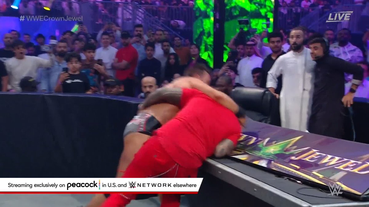 ROMAN REIGNS with the SPEAR through the BARRICADE! #WWECrownJewel