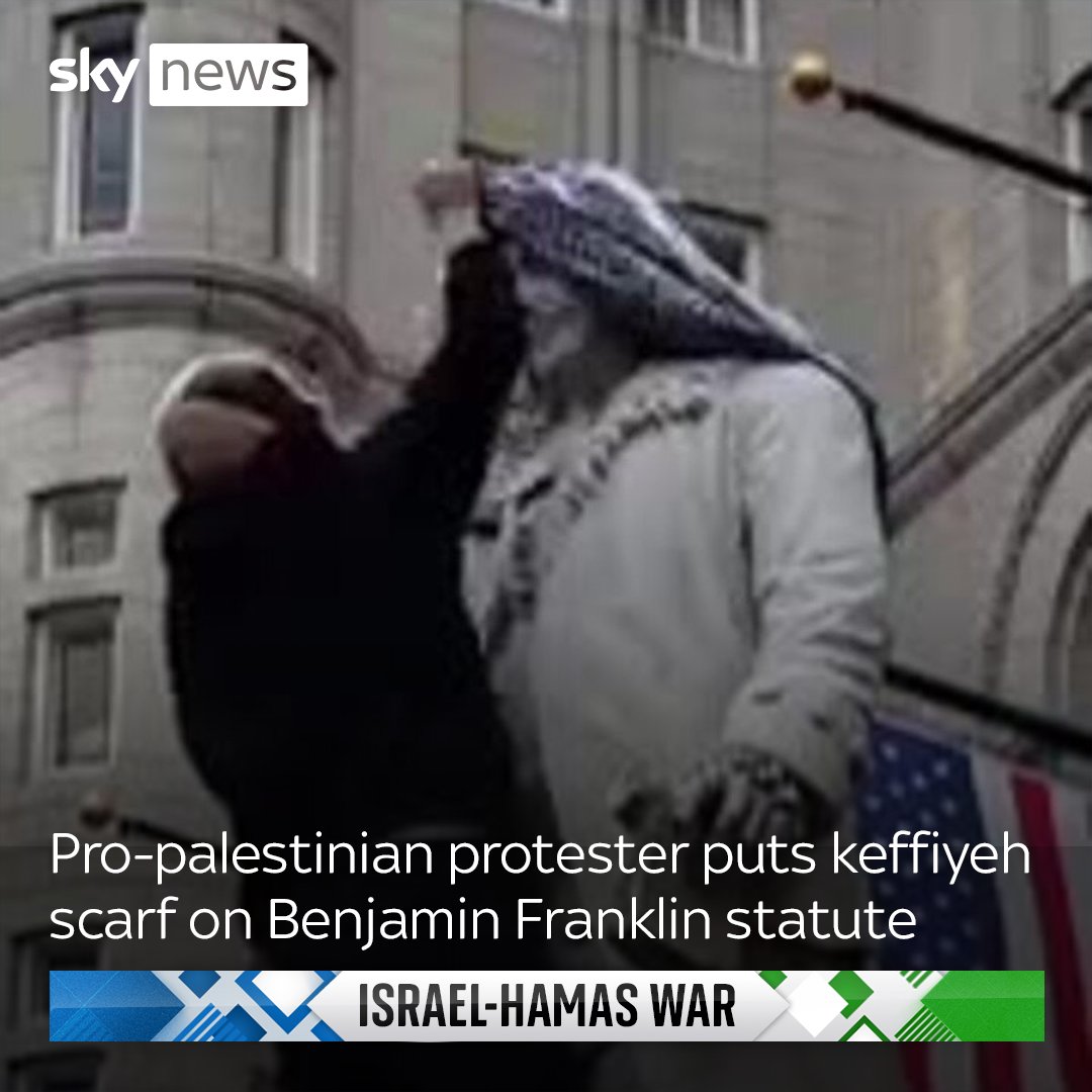 A pro-Palestinian protester was seen putting a keffiyeh scarf on a statue of Benjamin Franklin in Washington during a demonstration.