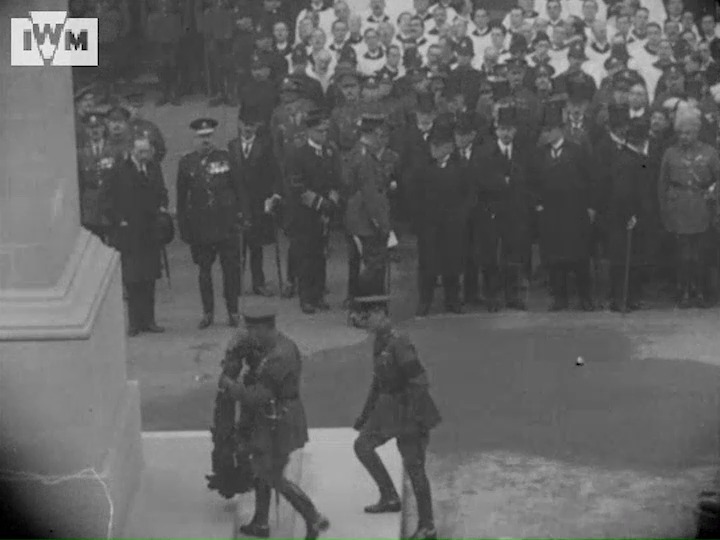 King George V unveils the Cenotaph before laying a wreath. He is joined by Prime Minister Lloyd George. Armistice Day, 1920. © IWM (IWM 505)