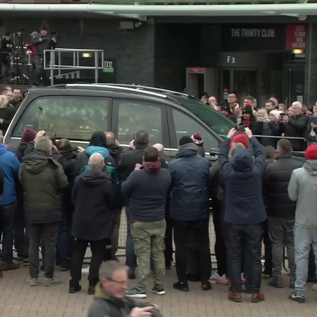 Sir Bobby Charlton's procession passes by the east stand to applause at Old Trafford