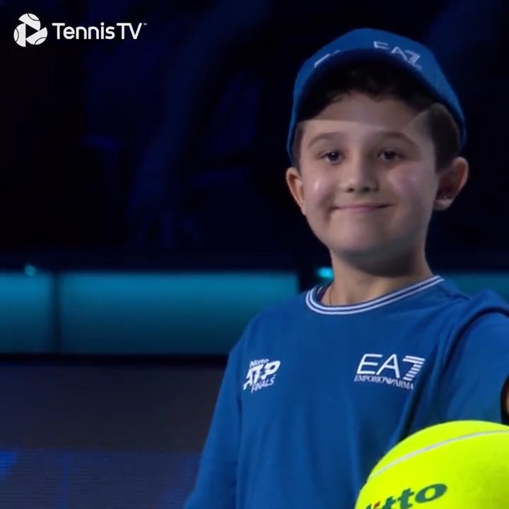 His little smile tho 😭 Wholesome moments as Jannik Sinner walks onto court with a *very* excited young fan at the #NittoATPFinals!