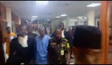 Godwin Emefiele being escorted to the Kuje Correctional Center.