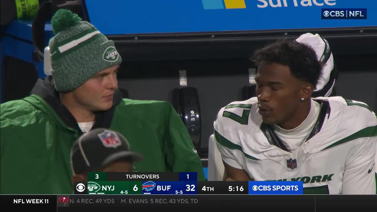 What could Zach Wilson and Garret Wilson be chatting about on the sidelines?