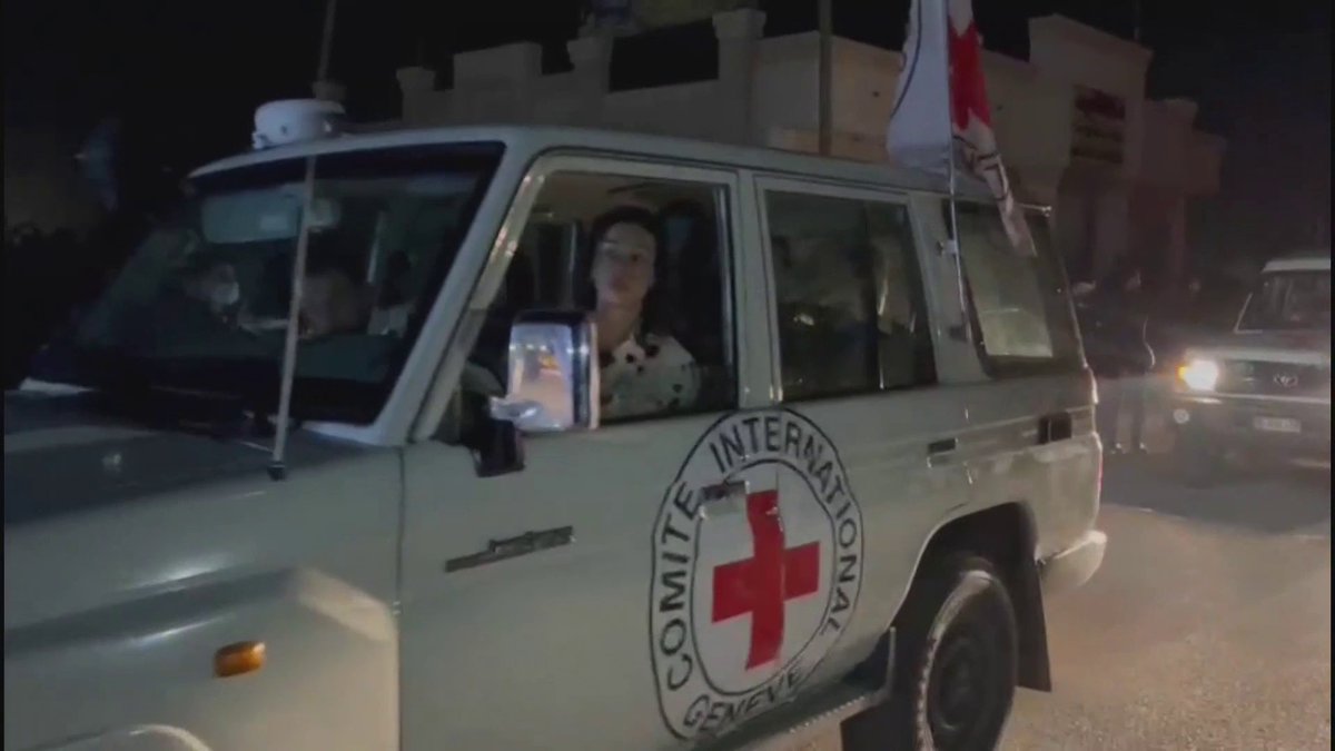 Palestinian civilians chase and jeer at the ambulances driving the Israeli women and children hostages out of Gaza.