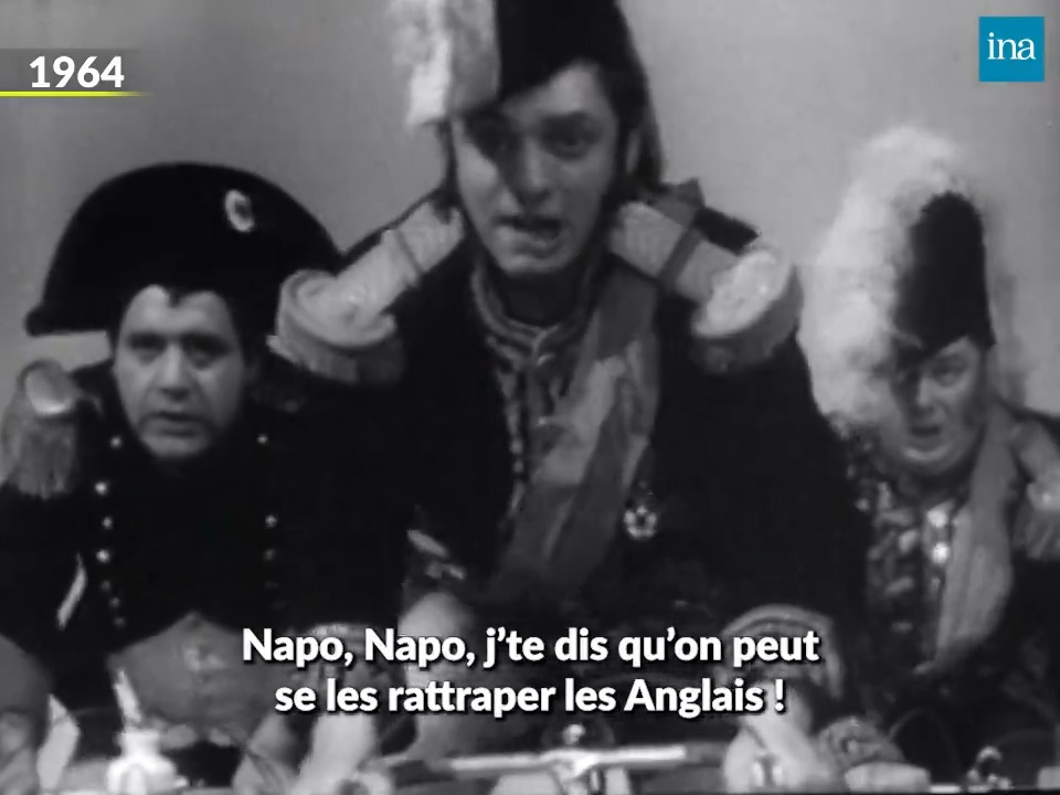 1964, Jean Yanne et Jacques Martin créent "1=3", une émission satirique qui détonne par son style et sa liberté de ton. Après seulement 5 numéros, l'émission est supprimée car les humoristes ont osé parodier la bataille de Waterloo !