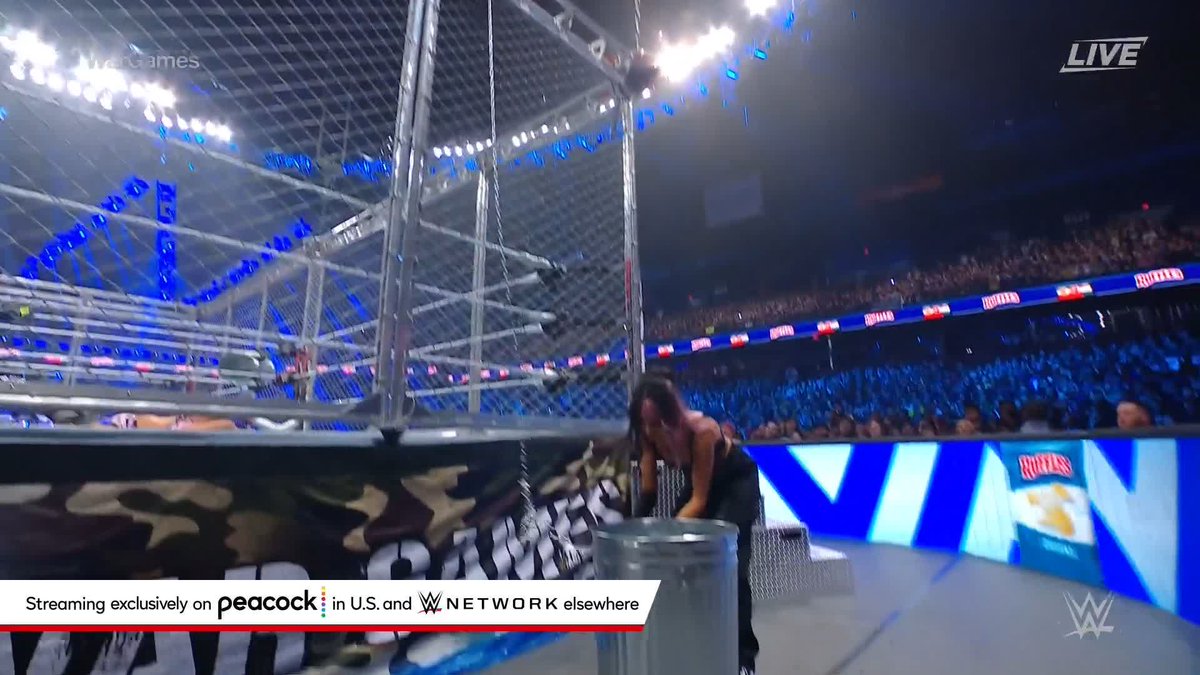 .IYO SKY goes crashing off the top of the cage in the Women's #WarGames Match at #SurvivorSeries!