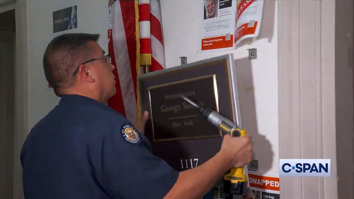Sign removed from the office of former Rep. George Santos (R-NY). Note: Video has no audio.