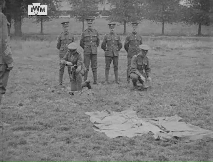 Soldiers of the Machine Gun Corps practise getting into position and loading a Lewis Gun, possibly at Aldershot, 1917. © IWM (IWM 438)