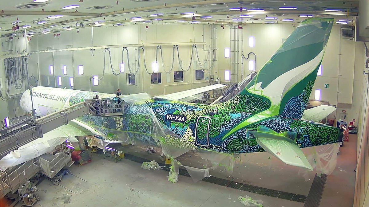 Watch the timelapse of our new QantasLink Airbus A220 ‘Minyma Kutjara Tjukurpa’ getting its very special paint job – the sixth aircraft to join our Flying Art Series with @balarinjidesign.