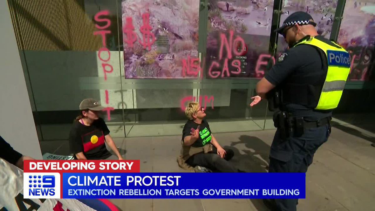 Climate activists have spray painted a government building, during hours of protest in the city. Penelope Liersch #9News