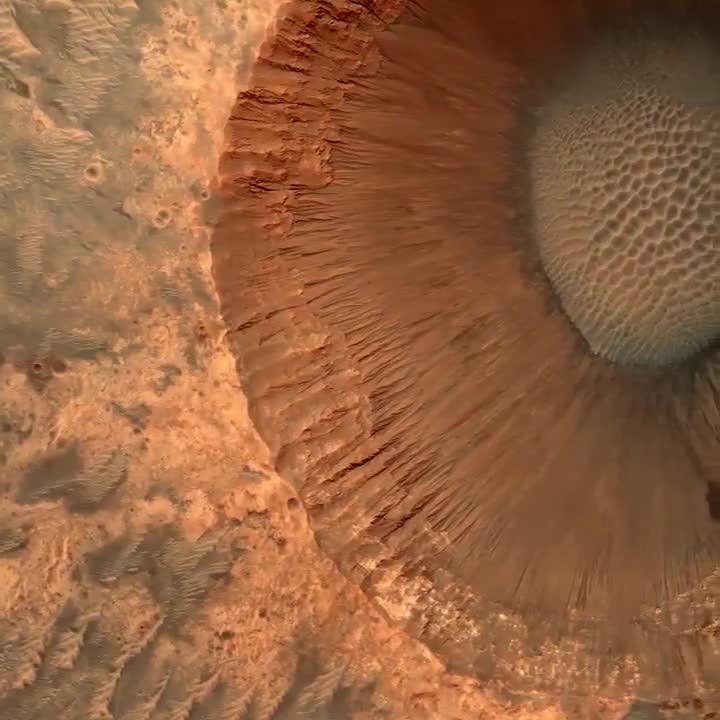 A 1.5-kilometer-wide impact crater on the surface of Mars. 📹 NASA/JPL/UArizona