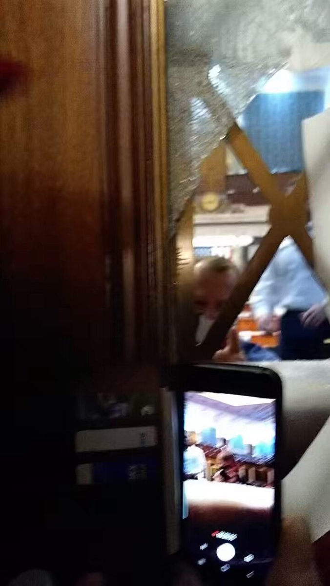 NEW: Dramatic new Jan. 6 video shows two GOP representatives speaking with Capitol rioters through the broken windows of the House chamber doors as officers point weapons at the mob attempting to breach the floor. This evidence was released in response to a request by NBC News.