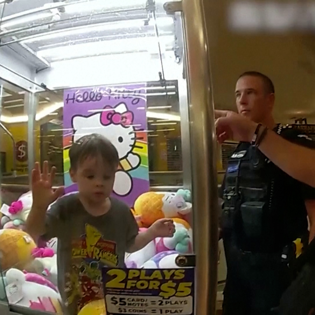 A toddler in Australia wearing a Power Rangers shirt crawled inside a Hello Kitty claw machine and stayed calm, as his dad looked on in disbelief.