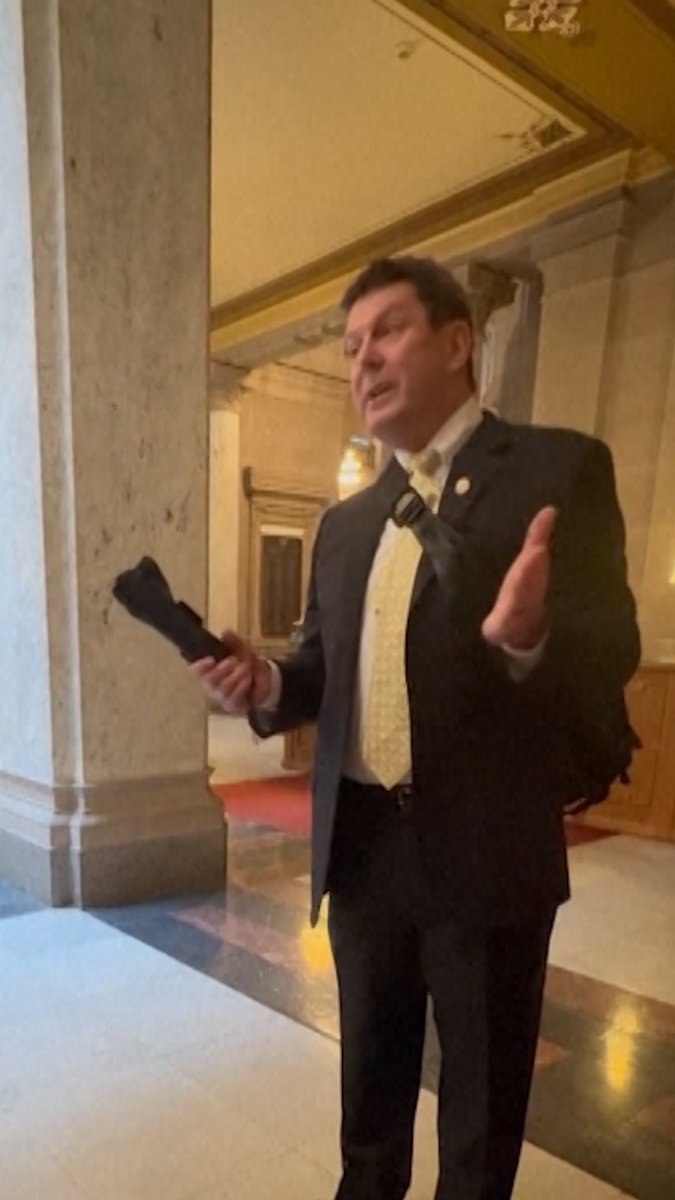 A video taken by a high school student captured Indiana state Rep. Jim Lucas showing his holstered firearm to a group demonstrating for gun control.