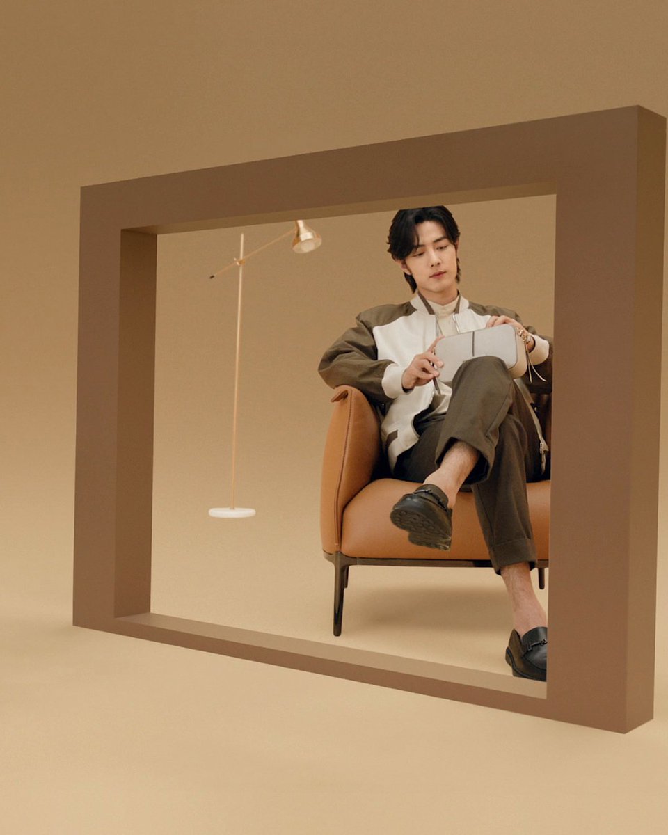 Timeless elegance. Global Brand Ambassador #XiaoZhan is portrayed in the new Tod’s Spring-Summer 2024 adv campaign gracefully wearing the T Timeless camera bag and T ring loafers. Watch the video and discover more at: #TodsSS24 #Tods