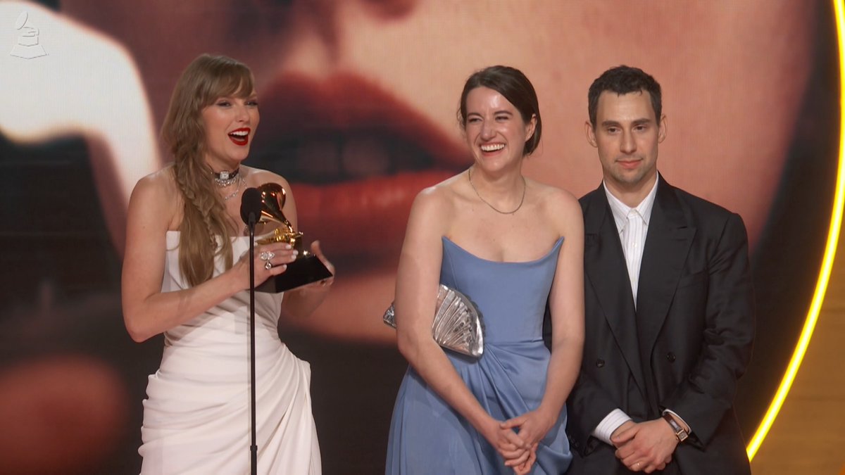 Karma is the girl on the screen, winning the GRAMMY. 🌟 Congrats to Taylor Swift for her record-breaking Album Of The Year #GRAMMYs win. Taylor is the first artist to win AOTY four times!