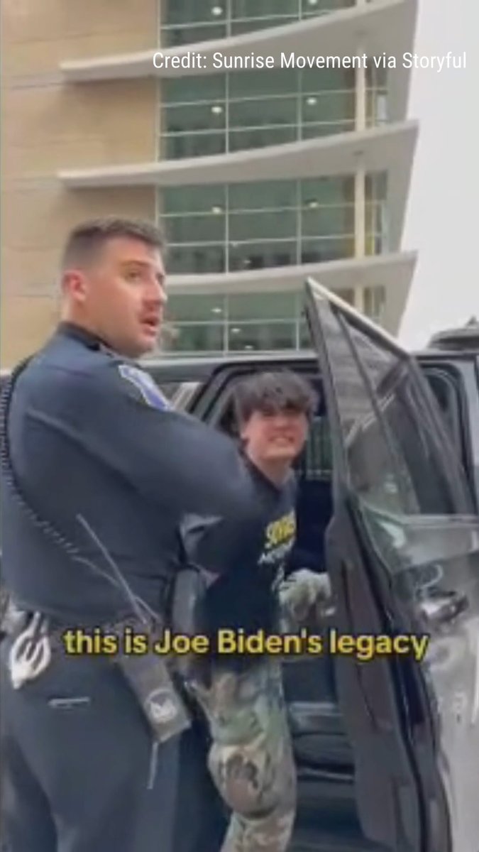 'THIS IS JOE BIDEN'S LEGACY': Climate protester handcuffed by police delivers enraged message to the president as more than 20 people in group get arrested at Biden's campaign headquarters.