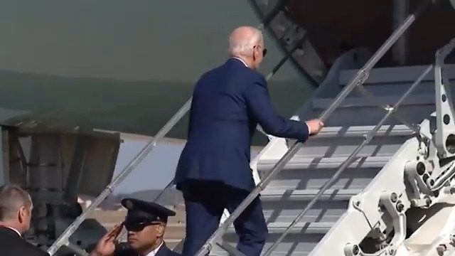 President Joe Biden nearly falls up the stairs again as he departs Washington for California.
