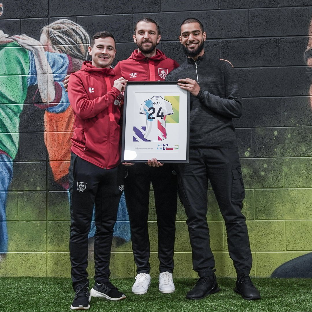 Jamaal Sajid is our Premier League Community Champion! ๐ Josh Cullen and Jay Rodriguez made a special visit to The Leisure Box to surprise Jamaal, who has earned the recognition for his involvement in Premier League Kicks sessions and the Burnley FC in the Community Youth Board ๐