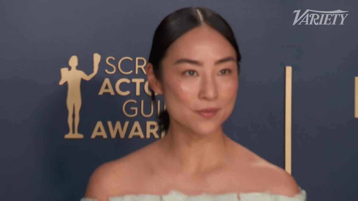 Greta Lee poses for photos at the #SAGAwards.