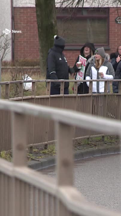 Parents have staged a protest in North Lanarkshire after the council cut school buses for their children – forcing them to walk alongside a dual carriageway on their walk to school.