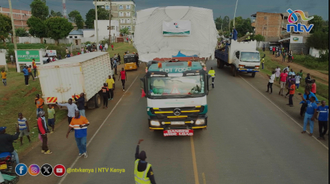 Bungoma residents gather along the road to see mysterious wide cargo load 'mnyama' headed towards Malaba border