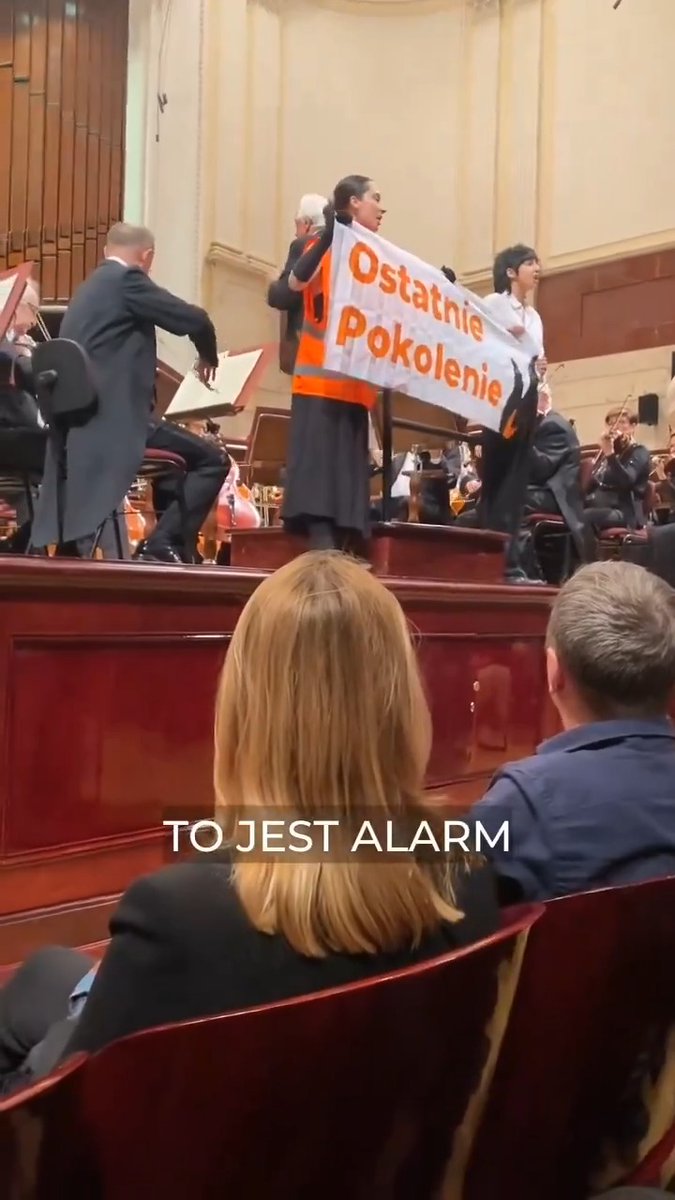 environmental protester at warsaw’s natl philharmonic hall not funny (until you unmute)