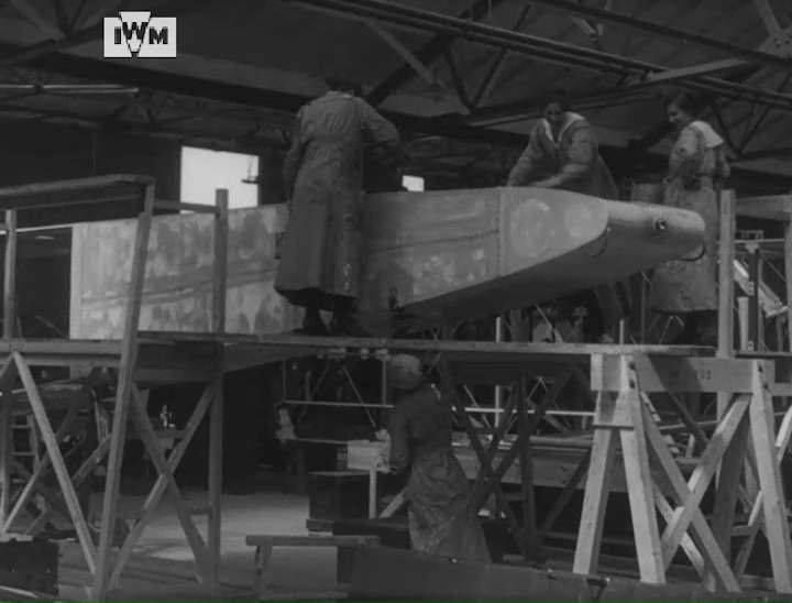 Women filmed at work at the Handley Page works at Cricklewood, London, during the First World War, spray painting Lewis machine gun magazines and doping the fuselage of a partially-assembled Handley Page 0/400 bomber. II. © IWM IWM 419 <1/2>
