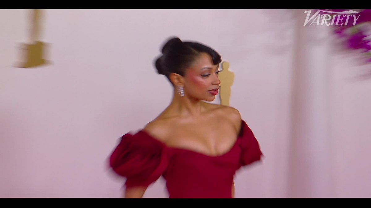 Liza Koshy flashes a smile after accidentally tripping on the Oscars red carpet.