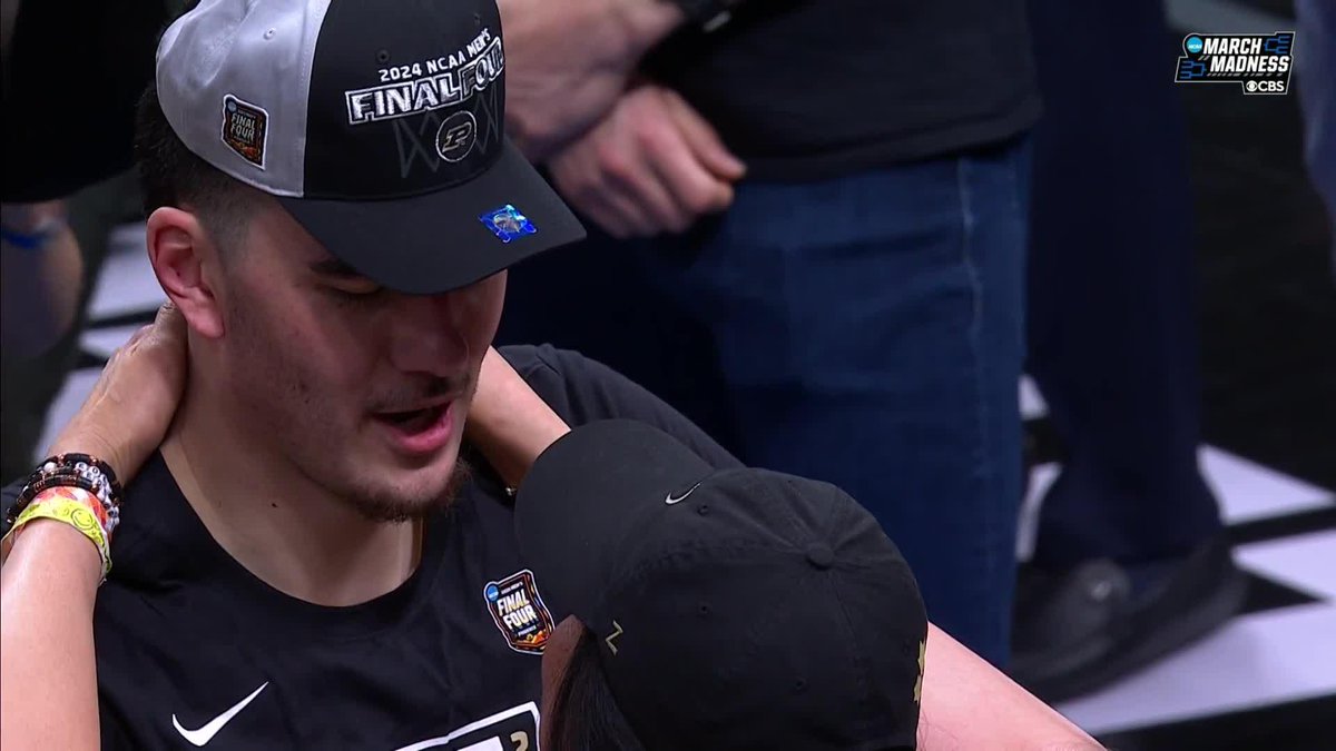 Zach Edey celebrating with his mom following Purdue's victory