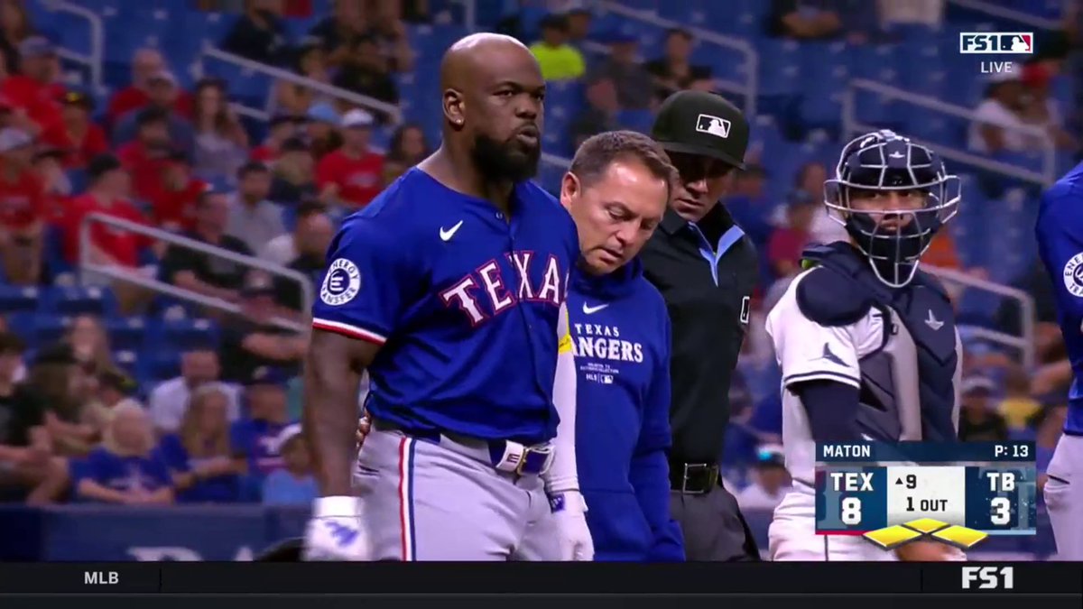 Adolis Garcia is visibly frustrated after being hit by a pitch with bases loaded