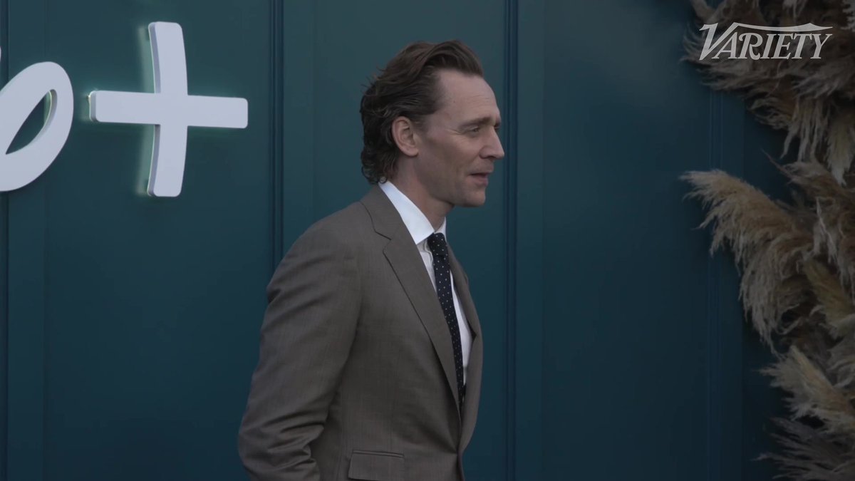 Tom Hiddleston poses for photos at the Hulu on Disney+ launch event in Los Angeles.