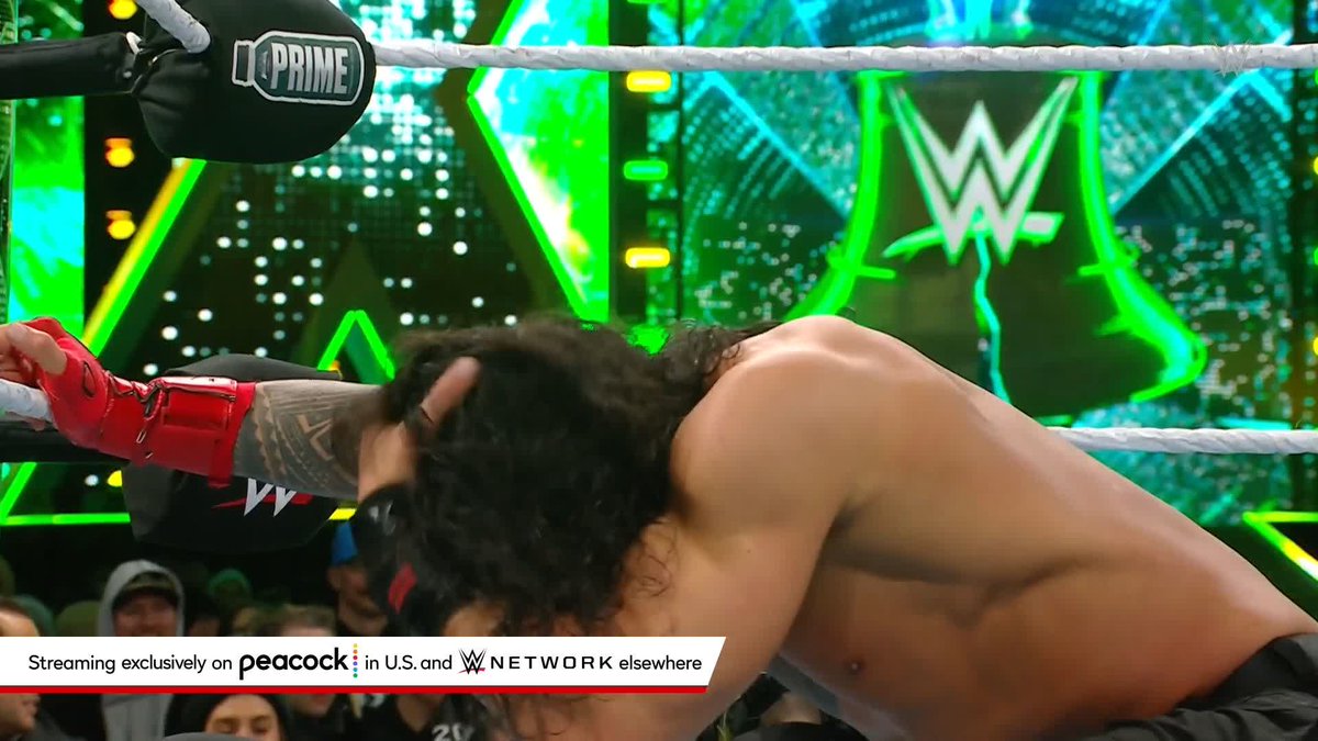 ROMAN REIGNS JUST SPEARED THE ROCK!!!!! #WrestleMania