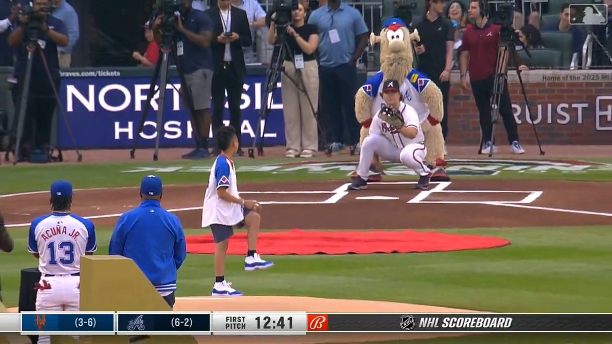 On the 50th anniversary of Hank Aaron's 715th home run, his great-grandson, King Aaron, tosses out the first pitch! ❤️