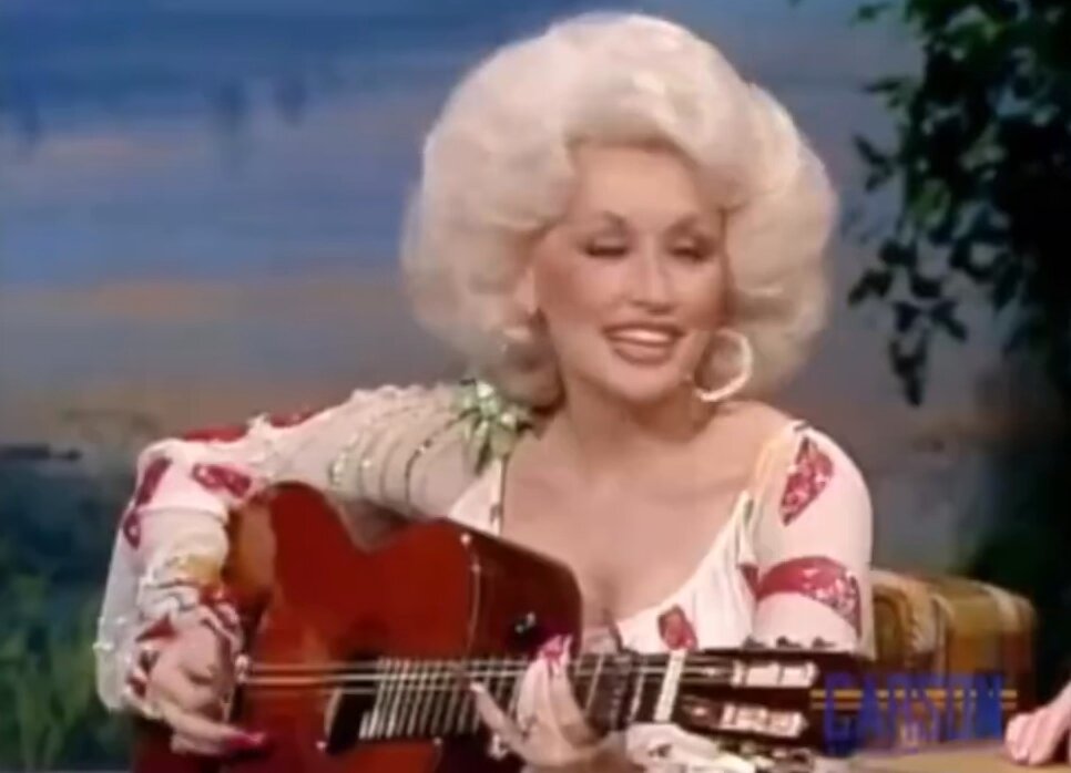 Dolly Parton managing to play a D Major chord while wearing acrylic nails will never cease to amaze me
