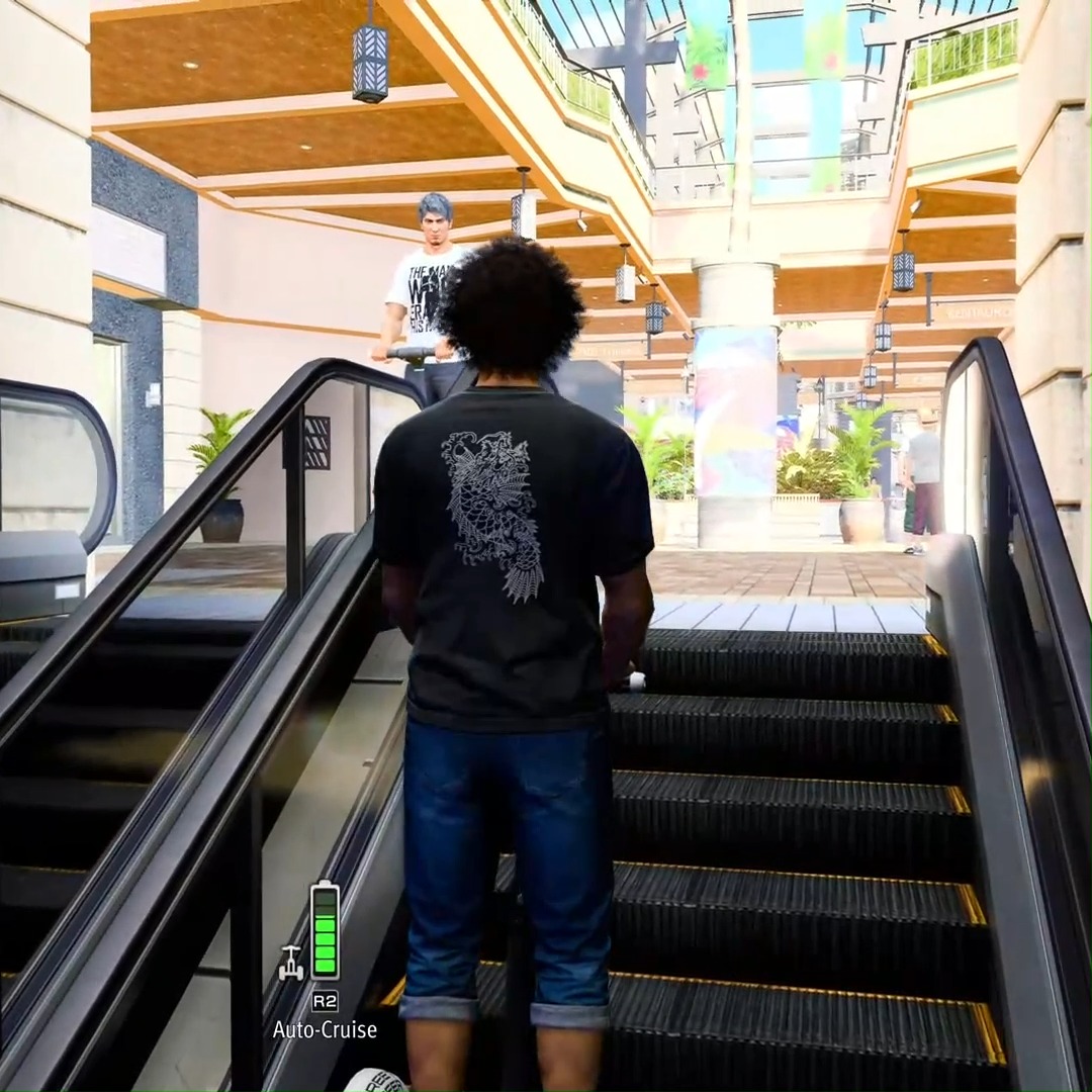 Kiryu doesn't look very happy about you riding your Street Surfer on the escalator. 😠 Explore all over Hawaii and Japan on this two-wheeled wonder in Like a Dragon: Infinite Wealth. 🏝️