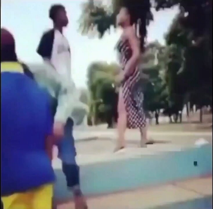 A woman beats her boyfriend after catching him cheating.
