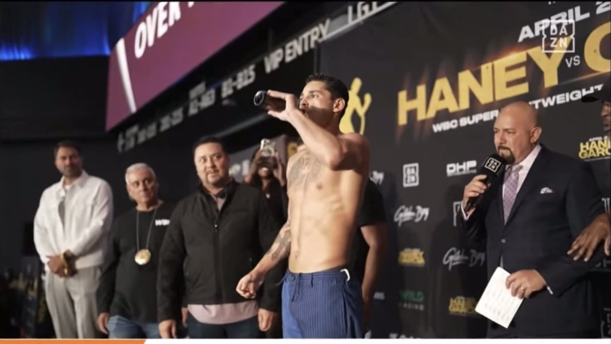 ‼️ Ryan Garcia doesn't even wait for Devin Haney to get onto the stage at the ceremonial weigh-in - jumps onto the scales, downs a beer and celebrates… [🎥 DAZN Boxing]