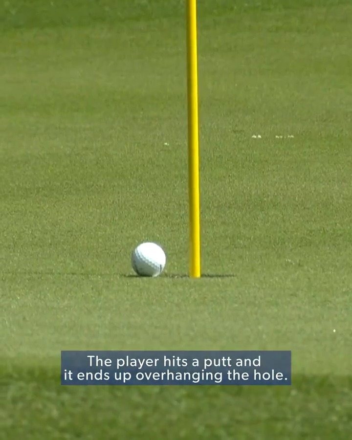 In 2021, Si Woo Kim's ball dropped after hanging on the lip of the hole for over a minute. Chief Referee Gary Young explains why he had to add a stroke to his score, despite the ball falling in the hole.